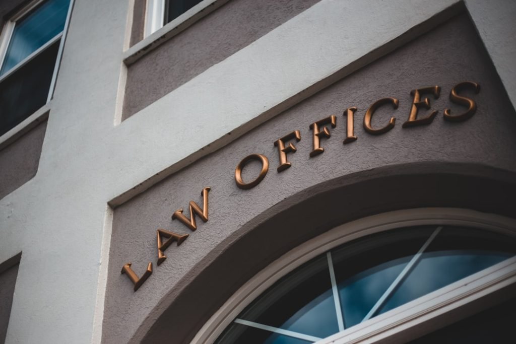 a-law-office-sign-on-the-side-of-a-building-24zoflny4ha